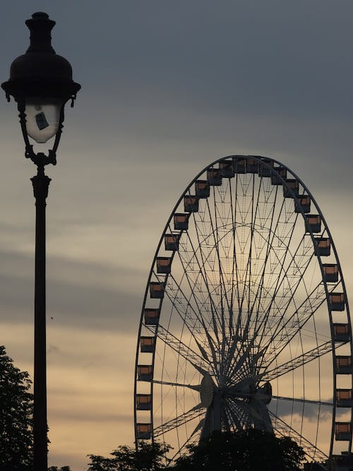Silhouette of Ferris Wheel on Sunset