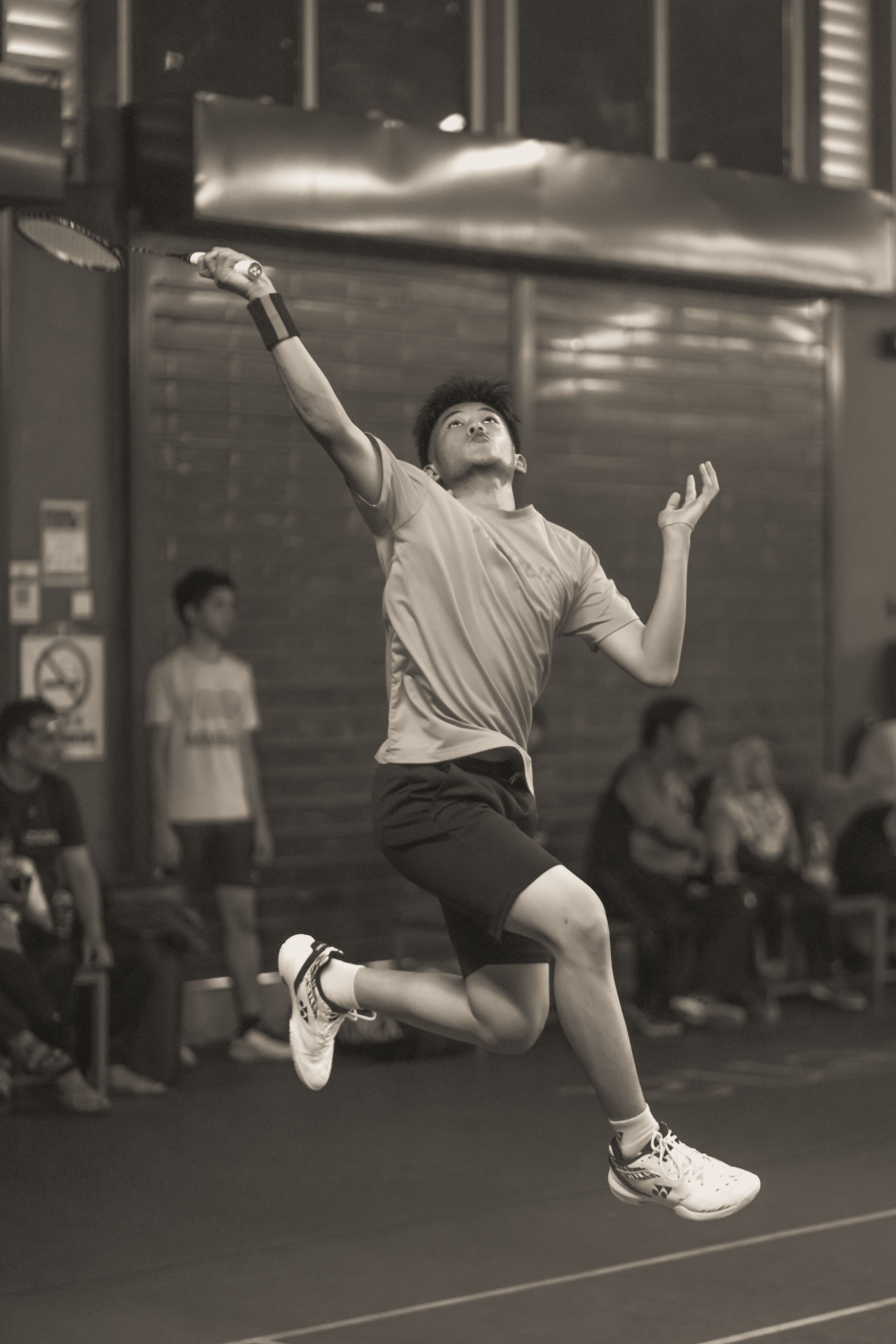 badminton singles match action