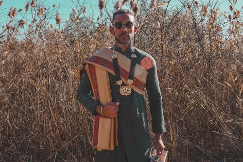 Man Posing in Traditional Clothing