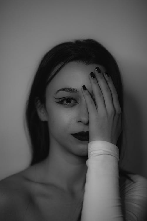 Woman Posing with Hand on Face