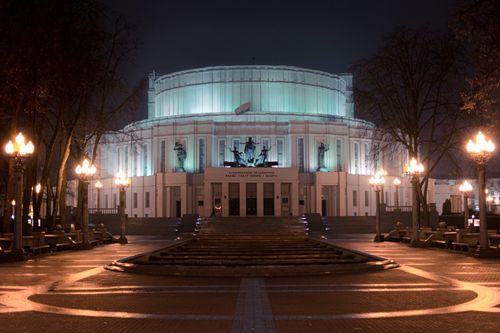 Free Illuminated view of the historic Minsk Opera House at night, a landmark in Belarus. Stock Photo