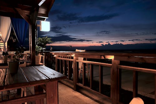 Vacant Tables and Chairs in the Balcony