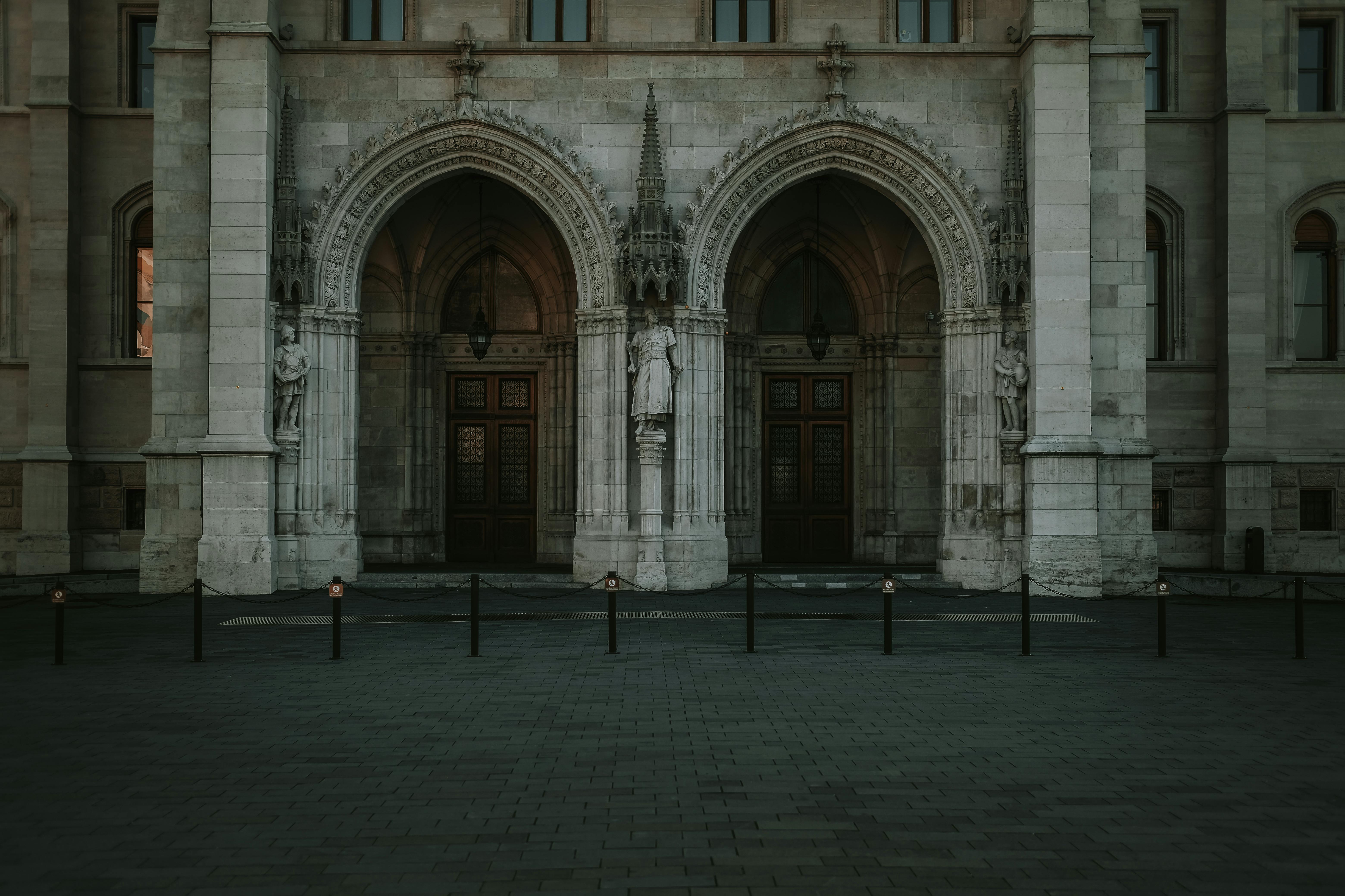 a large building with pillars and a clock