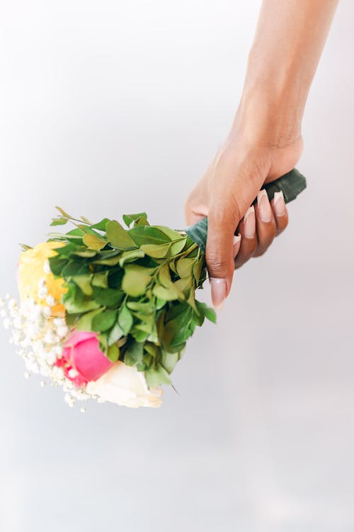 Studio Shoot of a Hand Holding a Bouquet
