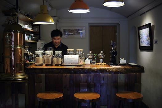 Warm, inviting coffee shop interior with barista preparing beverages behind a counter.
