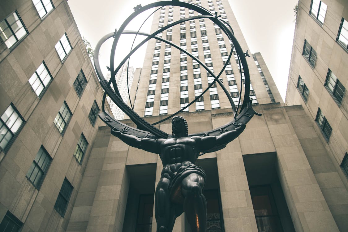 Free Low-angle Photography of Atlas Statue Stock Photo