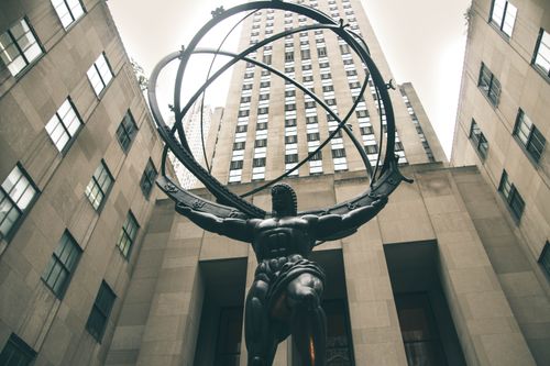 Free Low angle view of Atlas statue with skyscrapers at Rockefeller Center, New York City. Stock Photo