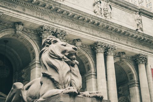 Free The majestic lion statue guarding the entrance of New York Public Library. Stock Photo