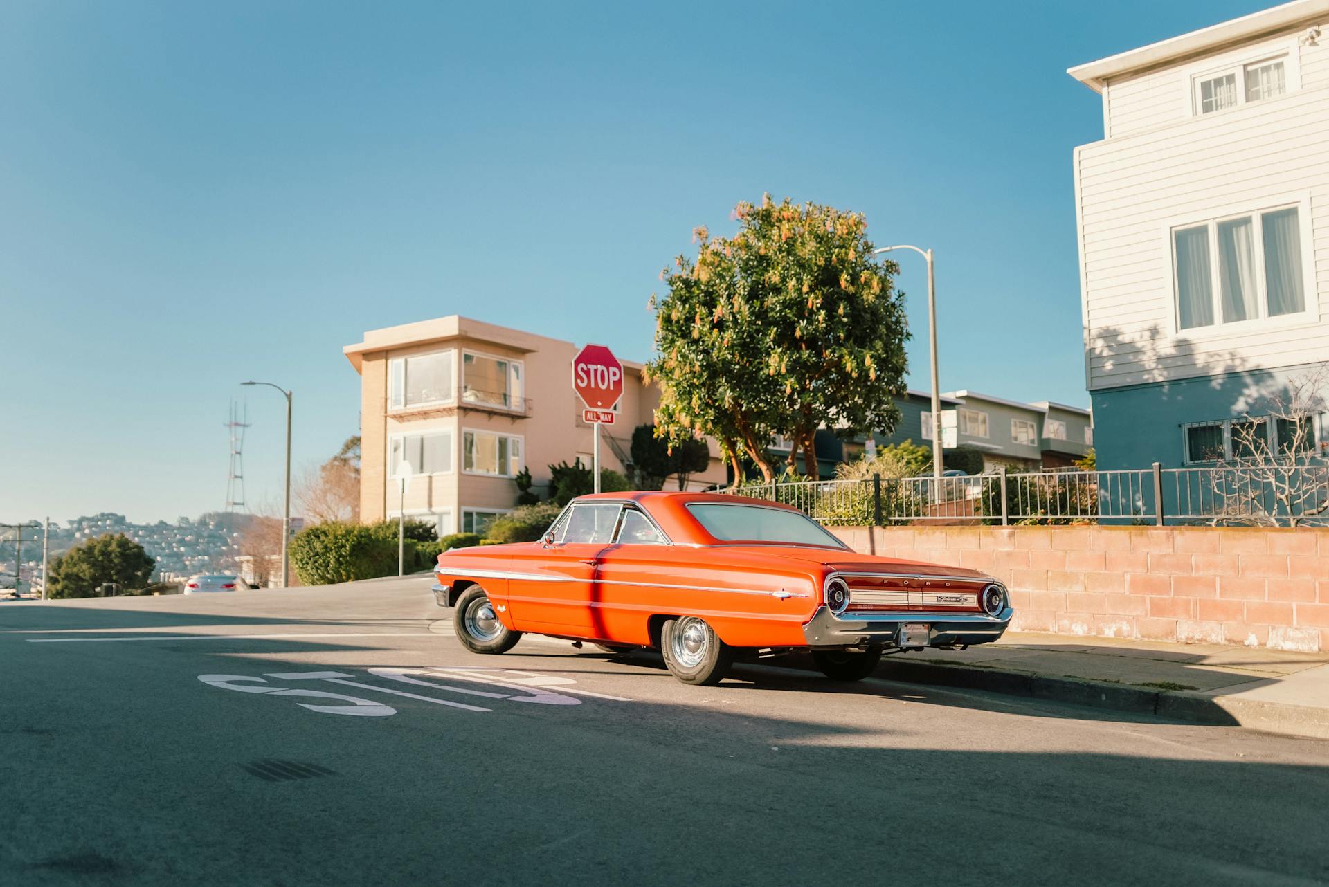 Red Vintage Car Stopped on the Crossroads