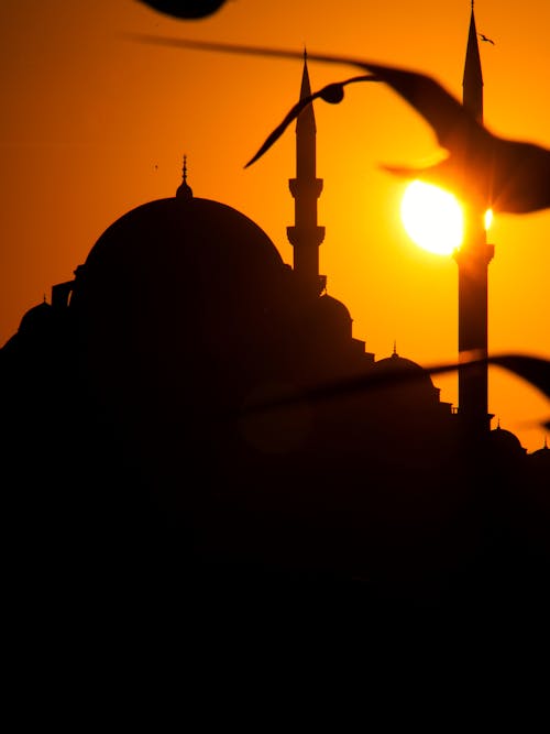 Foto profissional grátis de cair da noite, céu alaranjado, islã