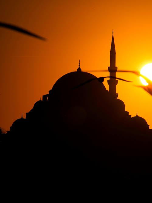 Mosque and Minaret Silhouette at Sunset