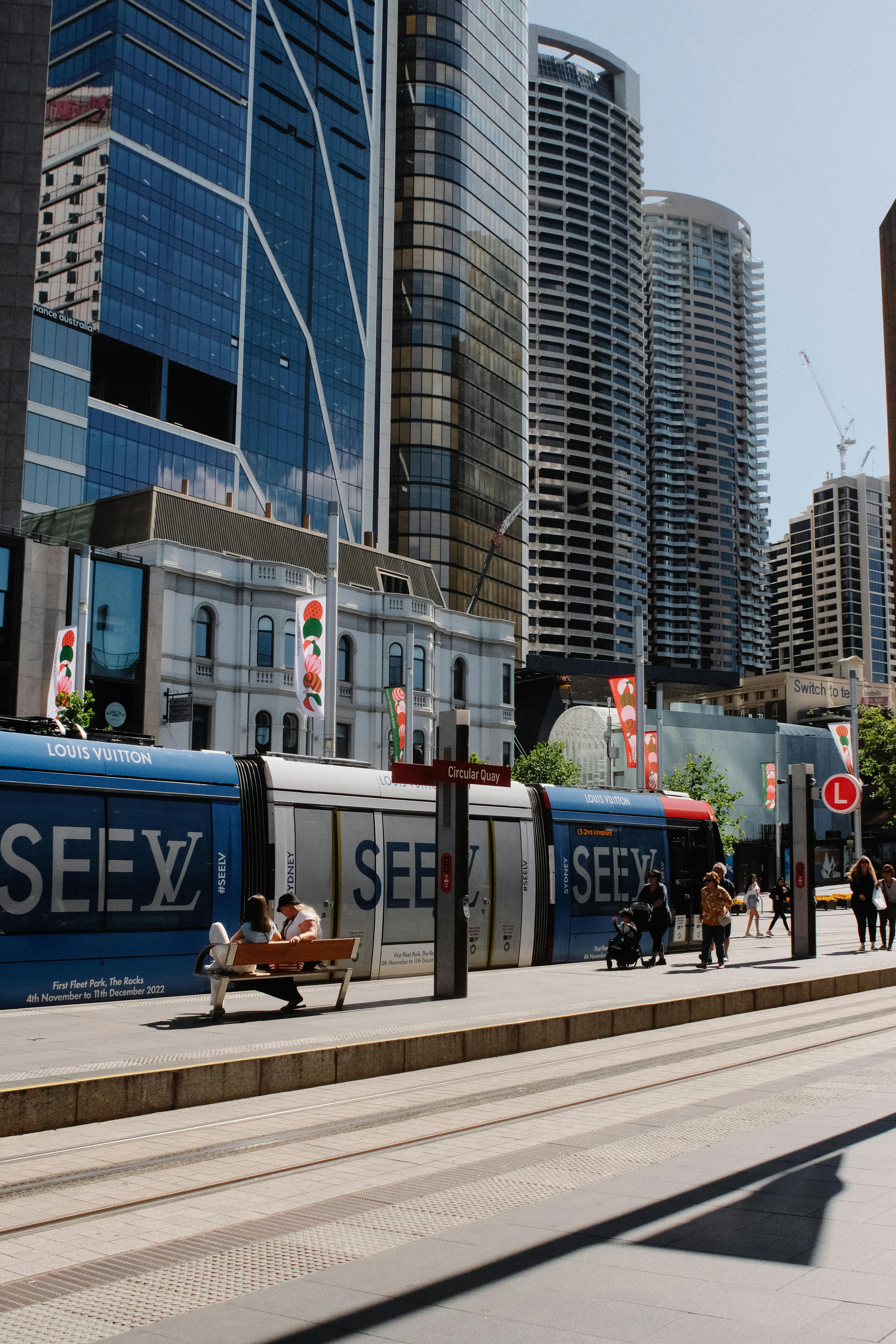 view of a tram station and modern skyscrapers in downtown sydney australia