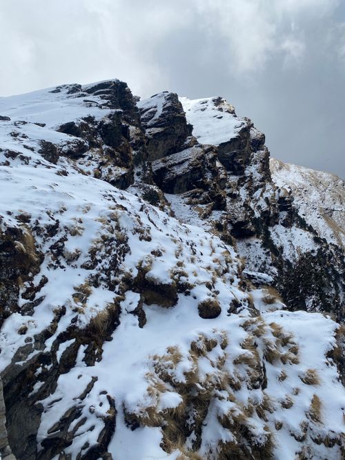 Free Stunning view of snow-covered rocky cliffs in Rudraprayag, India, capturing winter's beauty. Stock Photo