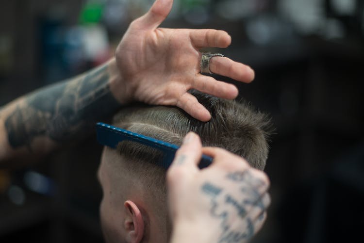 Person Combing Person's Hair