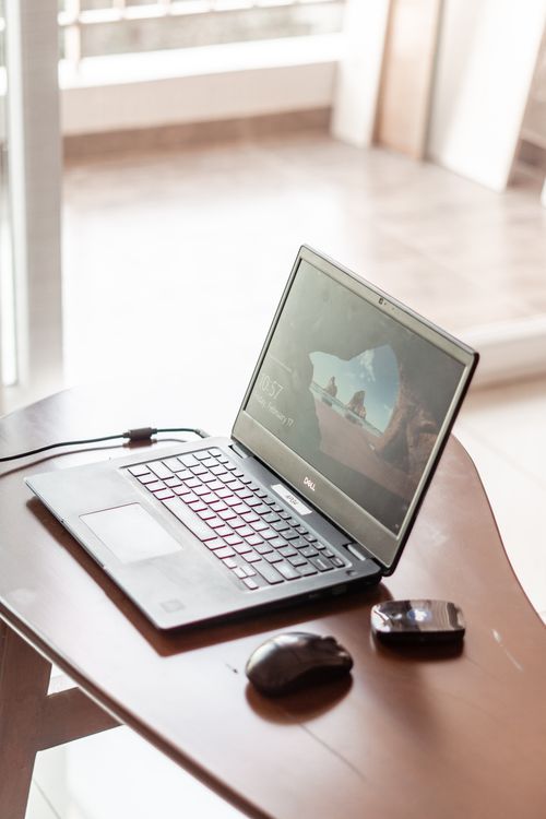Computer Below The Table White Wooden Table with Computer Under the Bookshelf · Free Stock Photo