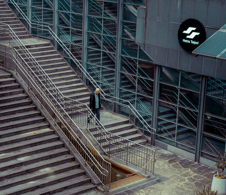 Man Walking Down The Stairs 