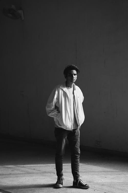 Man Posing in Jacket in Black and White