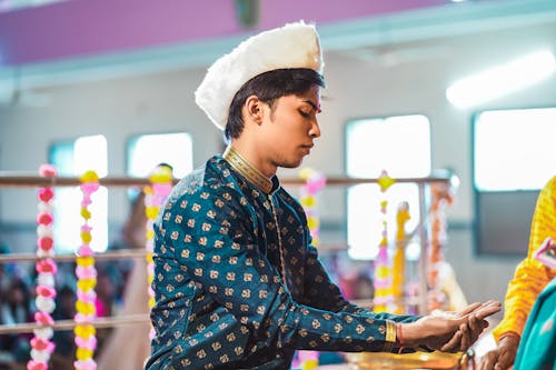 Traditional Indian male model offering prayers 