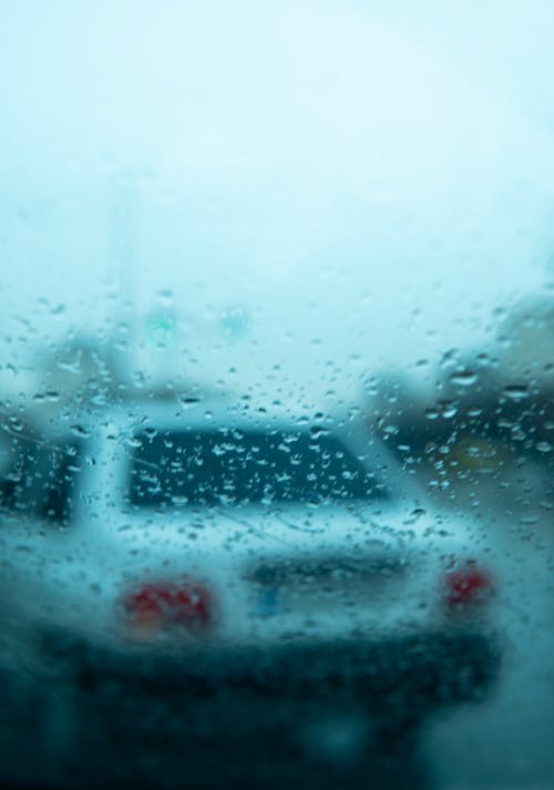 Foto profissional grátis de automóvel, chuva, desfocado