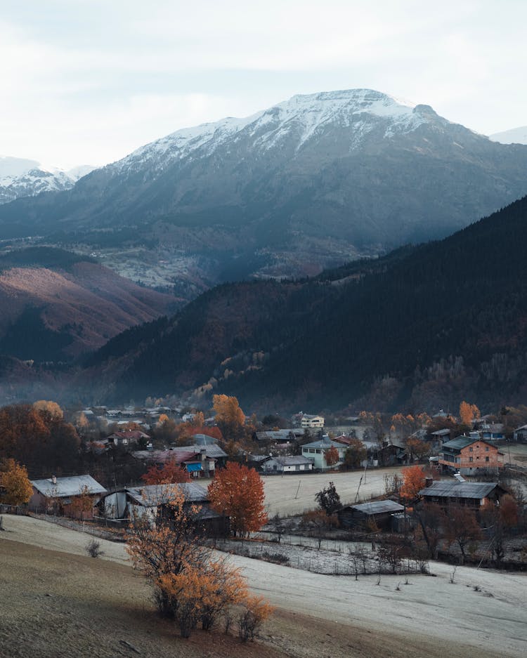 Mountain Village And Frost On Fields