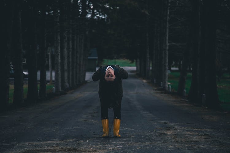 Woman Bending In Middle Of Road