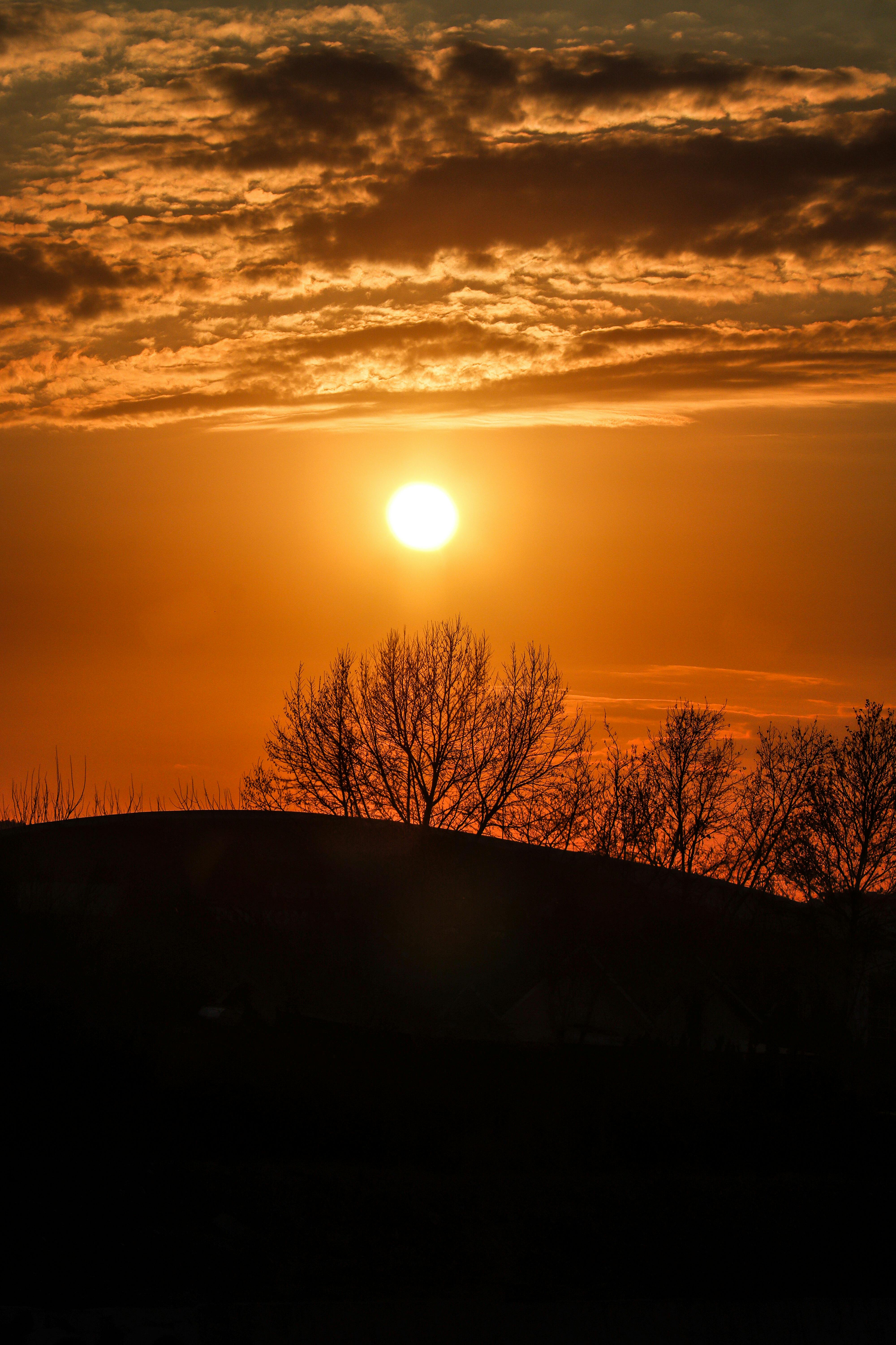 silhouette-of-a-building-on-a-hill-at-sunset-free-stock-photo