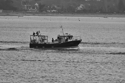 Fishing Boat on Sea Coast in Black and White