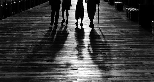 Silhouette of 4 Person Walking