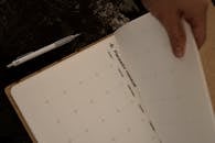 Woman Holding a Calendar