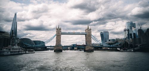 Free Stunning view of London's Tower Bridge with dramatic clouds overhead. Stock Photo