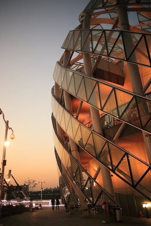 2 Person Walking Beside Dome Shape Designers Building