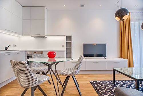 Clear Glass-top Table Near Flat Screen Television