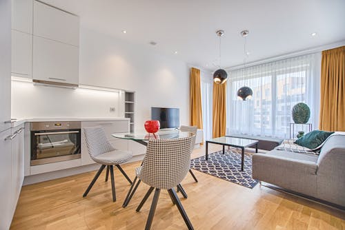 Free Two Chairs With Glass Table on Living Room Near Window Stock Photo