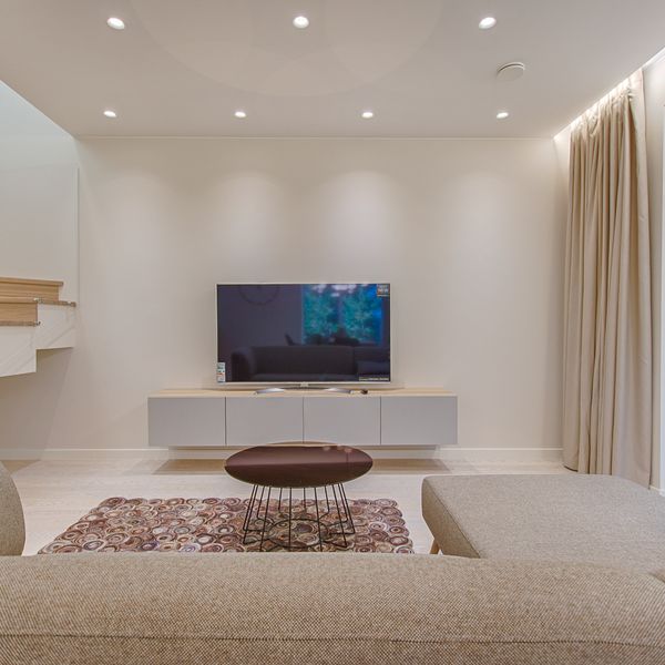 Bright, tidy living space with natural light and dust-free surfaces after a home cleaning