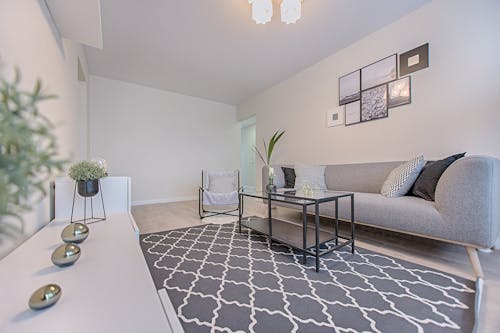 Three Gray Ornaments on White Wooden Desk Inside Living Room