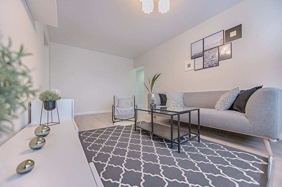 Three Gray Ornaments on White Wooden Desk Inside Living Room