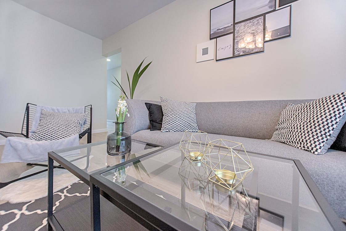 Grey Sofa and Rectangular Glass-top Coffee Table