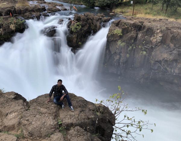 Dining room with elegant chandelier and accent lighting