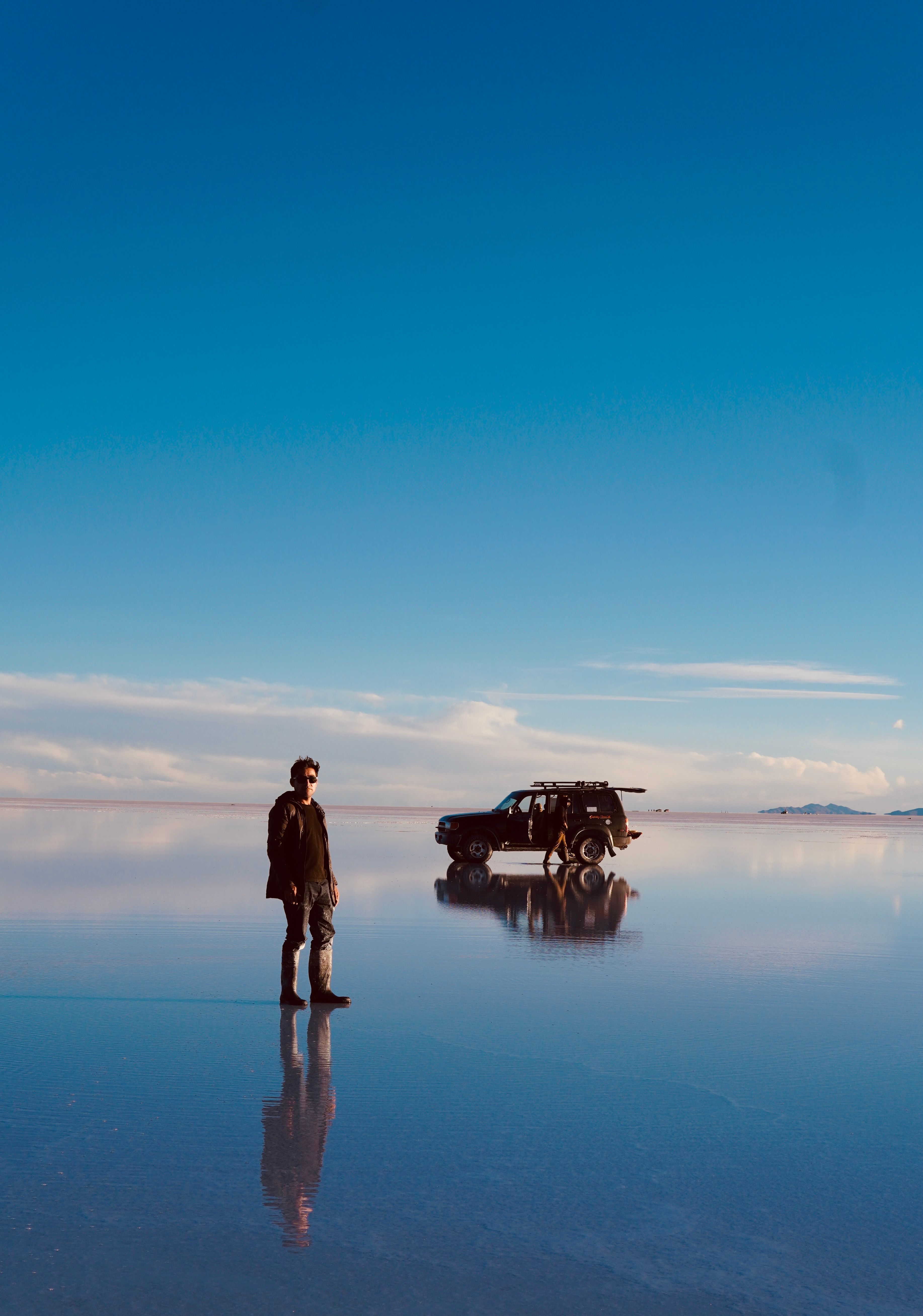 Blue Sky over a Man Standing in a Salt Flat · Free Stock Photo