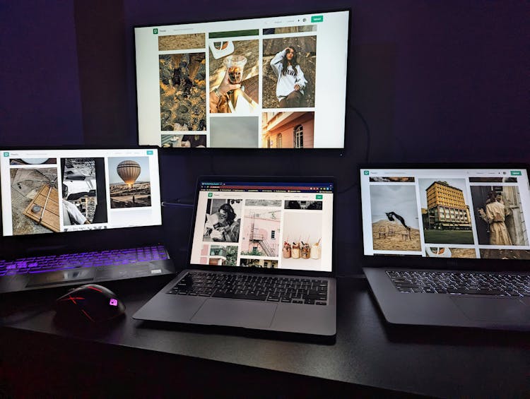 Laptops On Desk In Dark