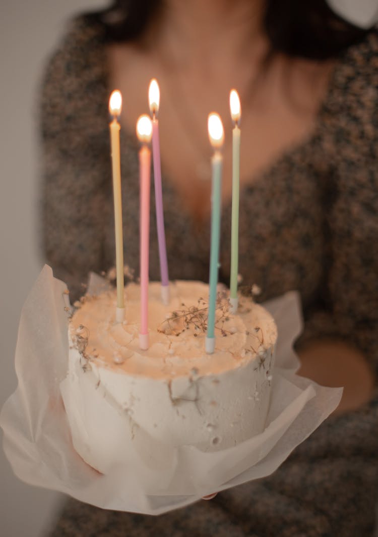 Burning Candles On Birthday Cake