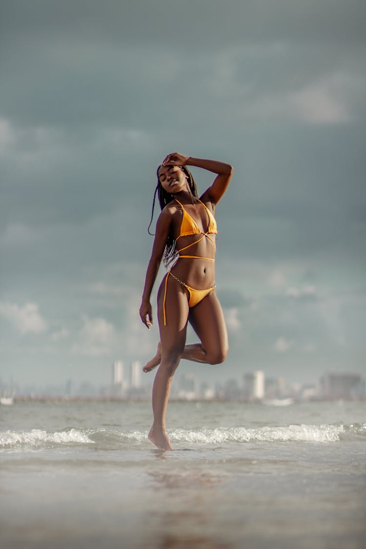 Woman In Bikini On Sea Shore