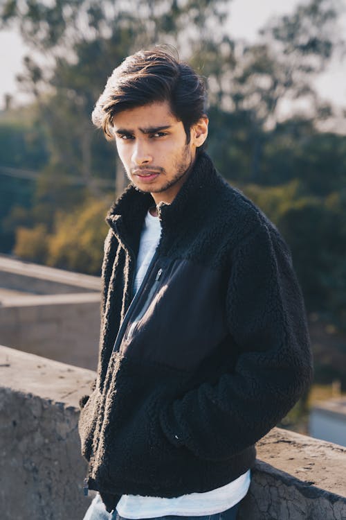 Man Posing with Hands in Pockets