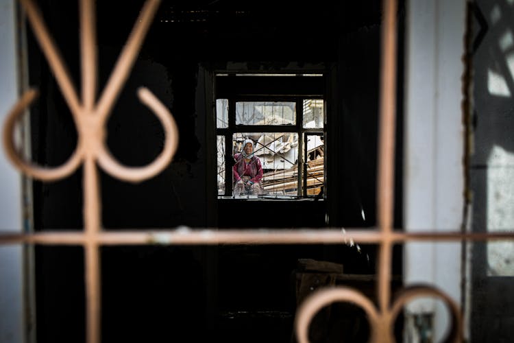 Woman Behind The Window Grating 