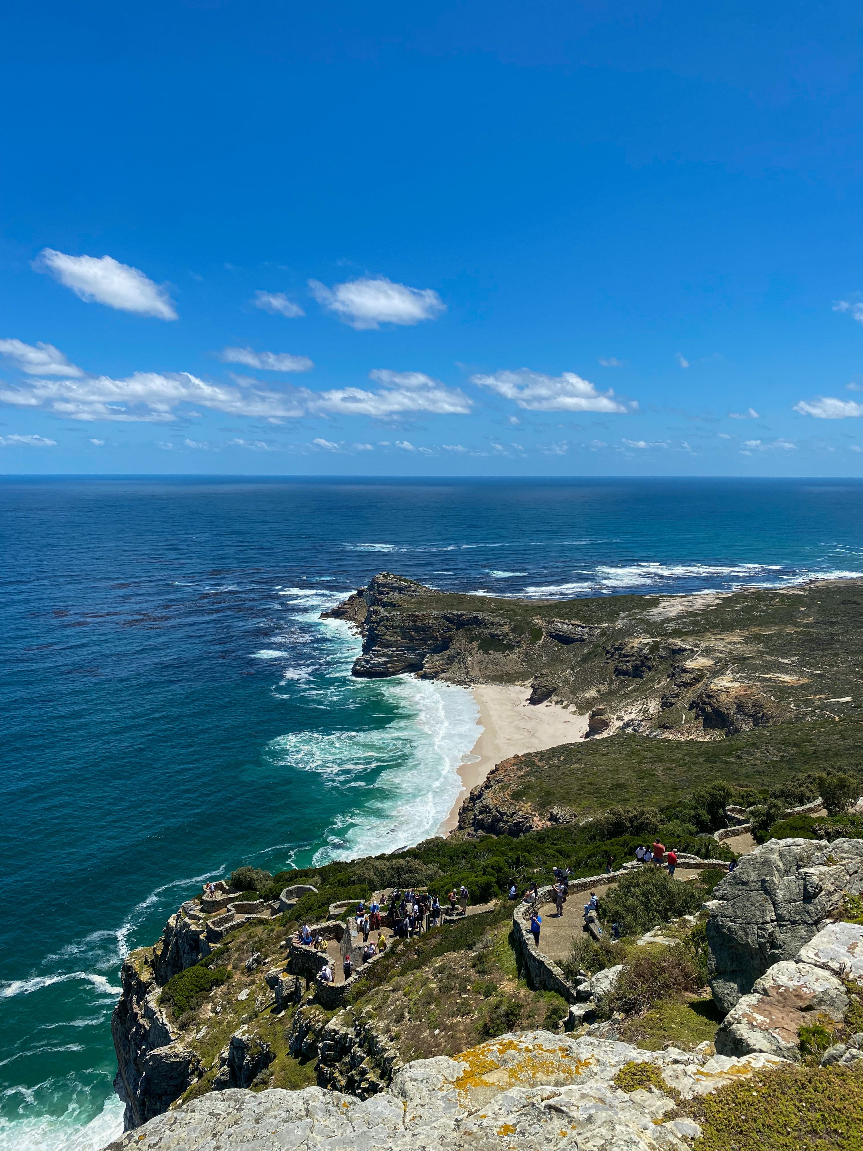 Rugged cliffs and deep blue ocean along the coast at the tip of the Cape Peninsula
