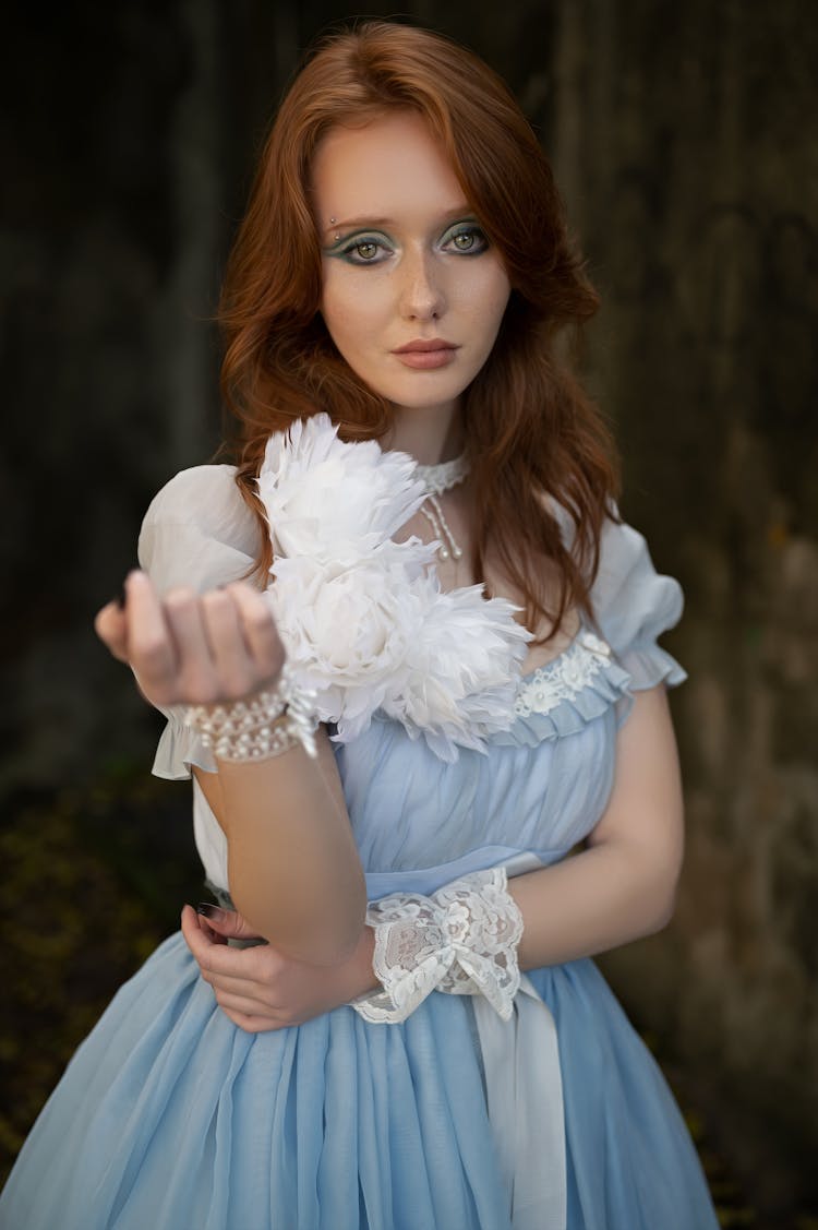 Woman Posing In Blue And White Dress