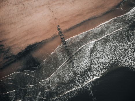 Stunning aerial view of waves meeting the sand at Hartlepool Beach, England.