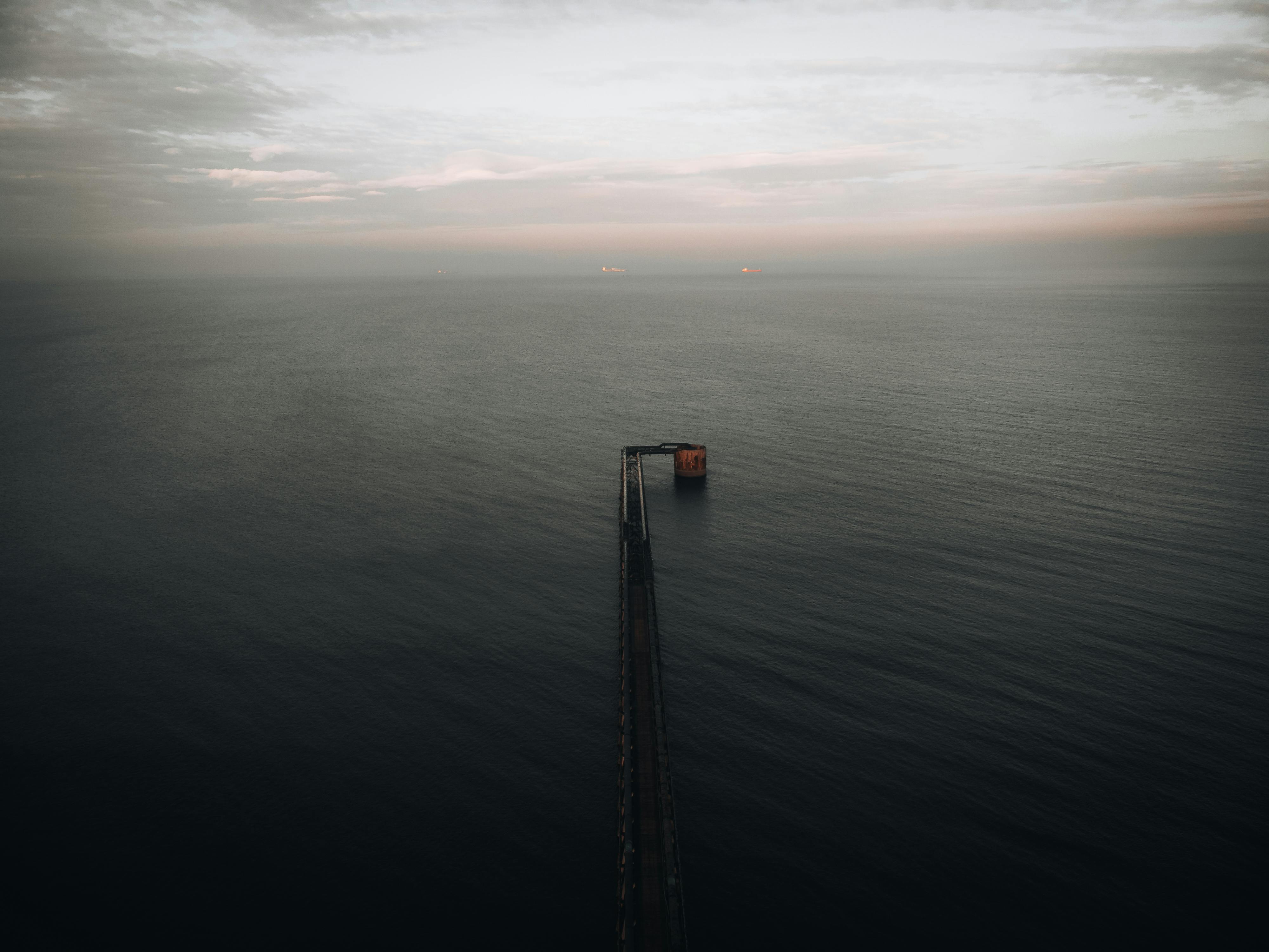 A breathtaking aerial view of Hartlepool Pier stretching into the North Sea at sunset, England.