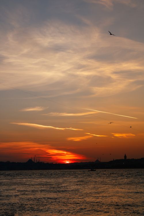 Free Beautiful orange sunset over the Bosphorus in Istanbul with skyline silhouette. Stock Photo