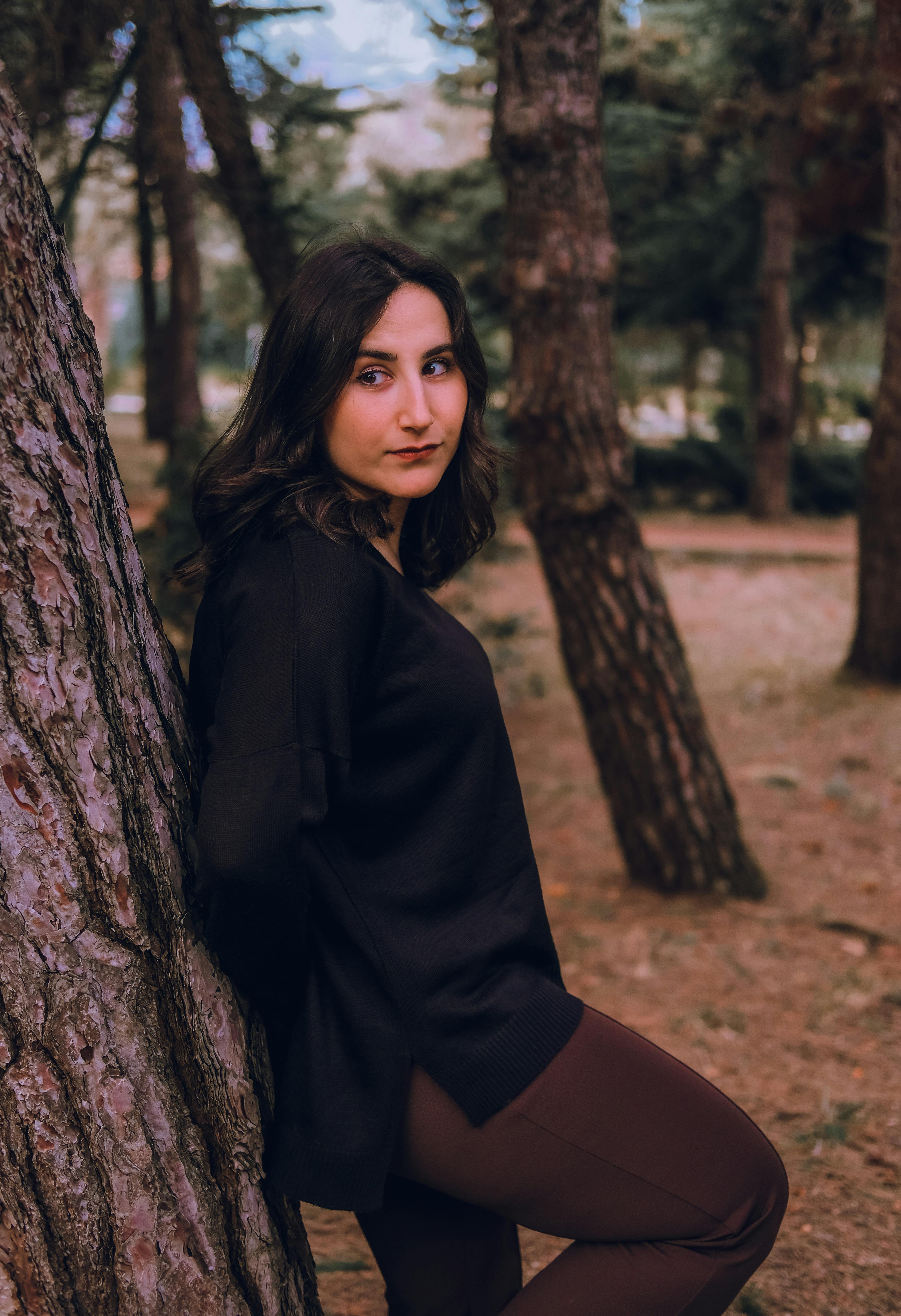 Woman Posing behind Chair · Free Stock Photo